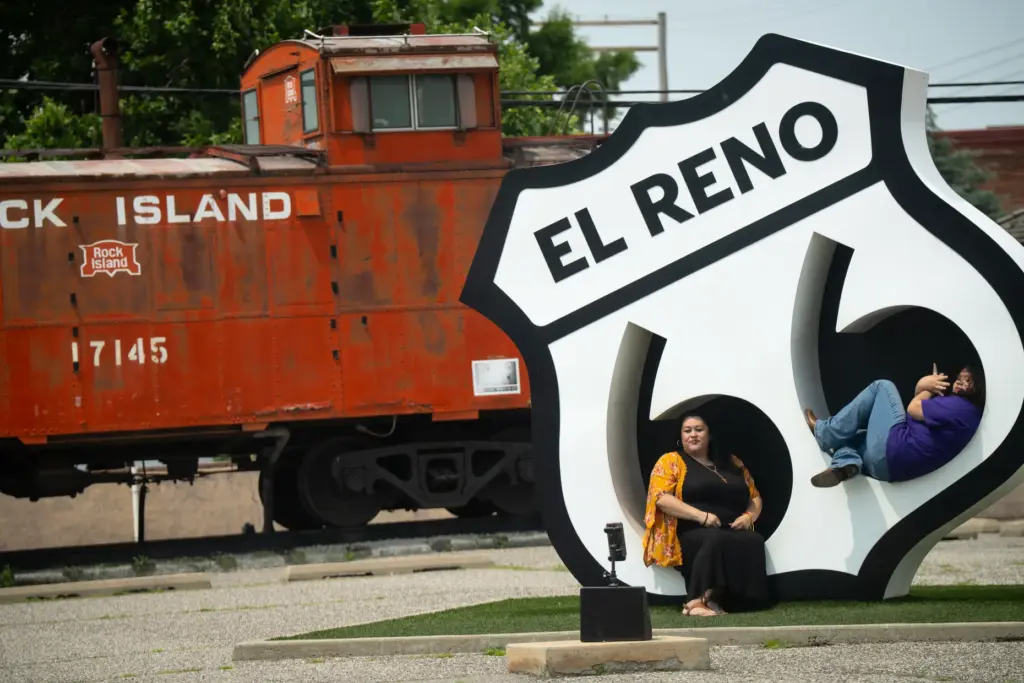 Tourists pose for pictures in downtown El Reno, Oklahoma, Saturday,...
