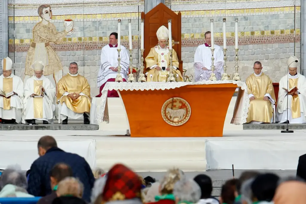 FILE – Pope Benedict XVI, center, celebrates a Mass in...