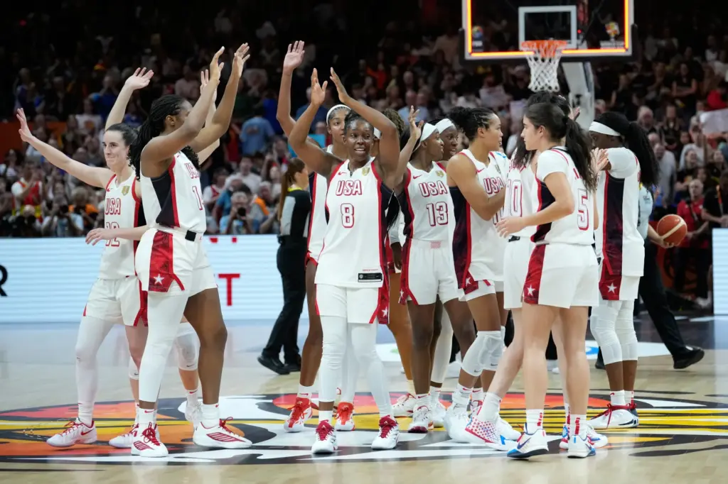 Team USA players celebrate after defeating France in the FIBA...