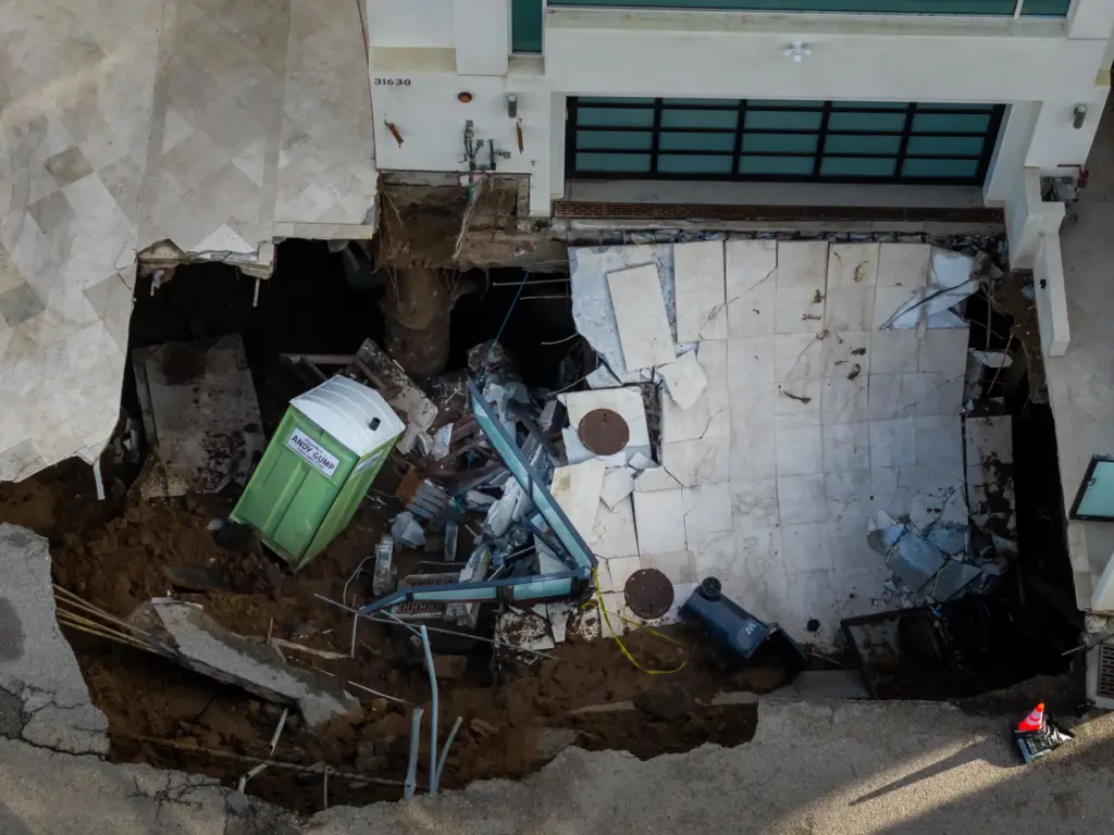 An aerial view of a sinkhole which collapsed the driveway...