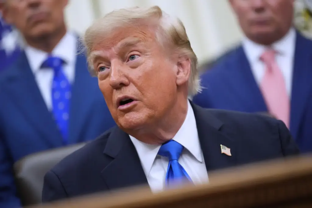 President Donald Trump speaks to reporters in the Oval Office...