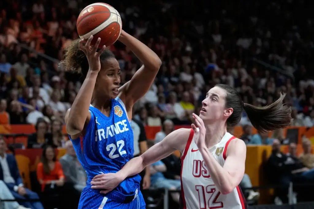 Team USA’s Caitlin Clark, right, defends France’s Marieme Badiane during...