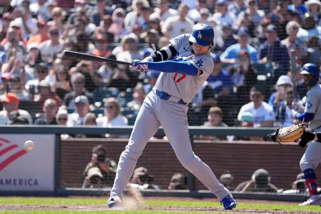 Dodgers’ Shohei Ohtani hits a single against the San Francisco...