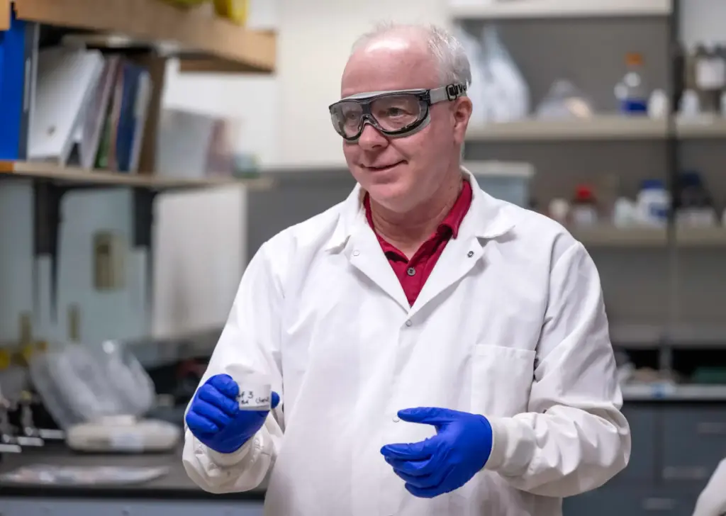 Cal State Fullerton Chemistry Professor Daniel Curtis instructs his students...