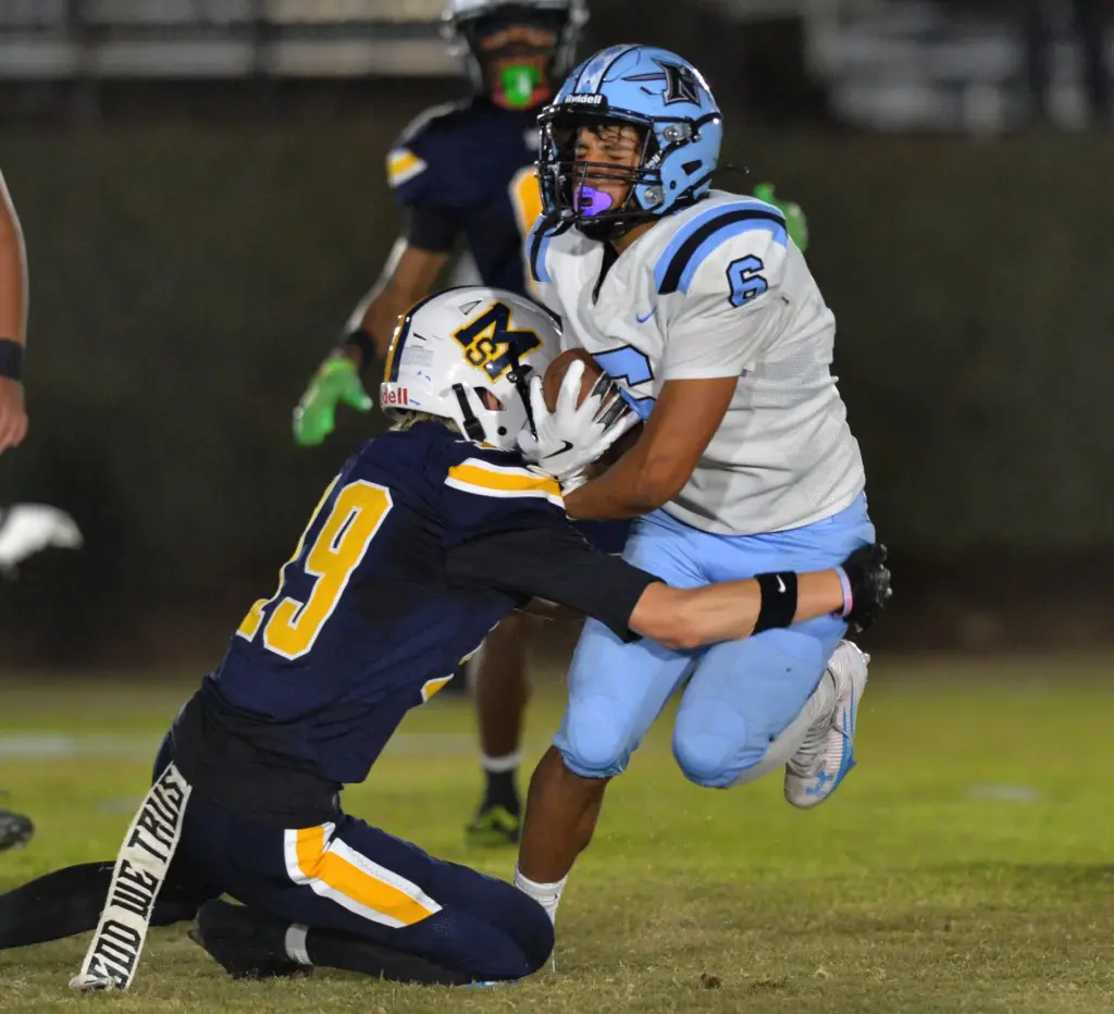 North Torrance’s Ricardo Gonzalez is stopped by Mary Star’s Gabe...