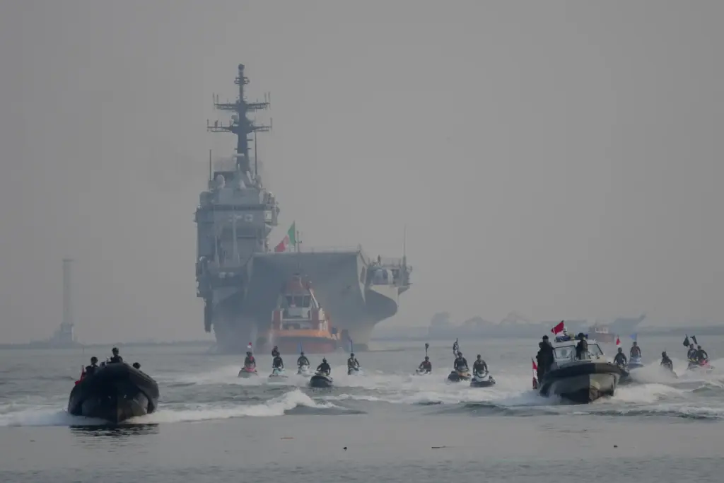 Indonesian Navy personnel escort the Giuseppe Garibaldi, a former Italian...