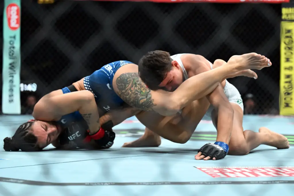 Casey OâNeill (red) vs. Eduarda Moura (blue) during their fight...