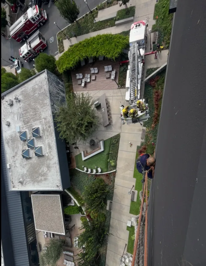 Firefighters rescued a window washer who was stranded about 60...