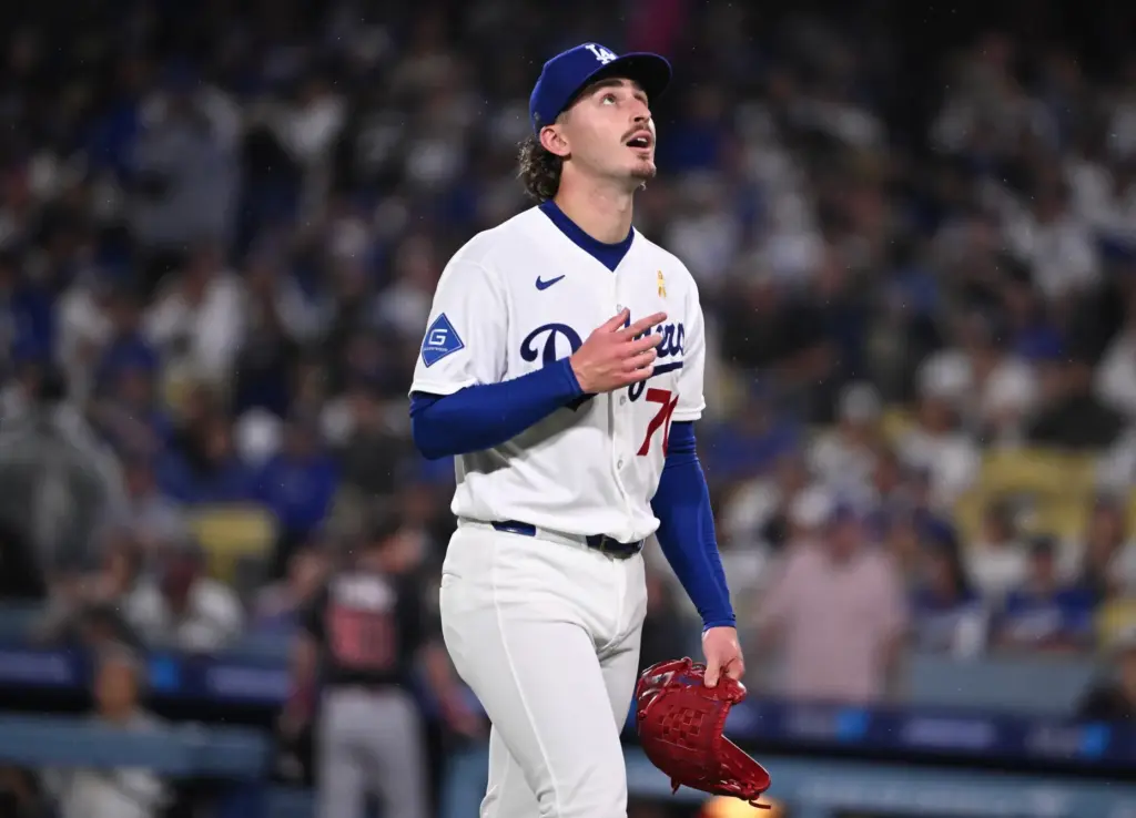 Dodgers starting pitcher Justin Wrobleski reacts after being removed from...