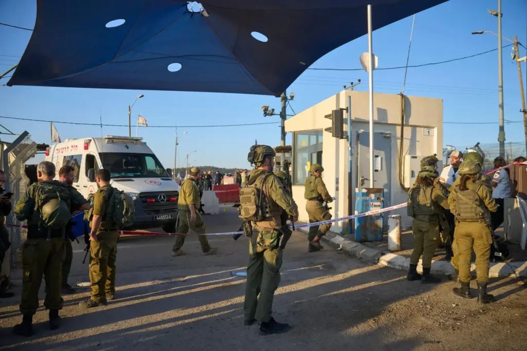 Israeli security forces inspect the scene where, according to police,...
