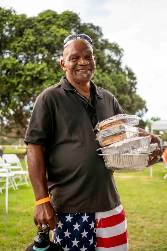 Augusto Esquvel poses for a portrait while taking cookies and...