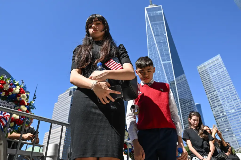 Aerias Pinto and her brother, David Pinto, pause during a...