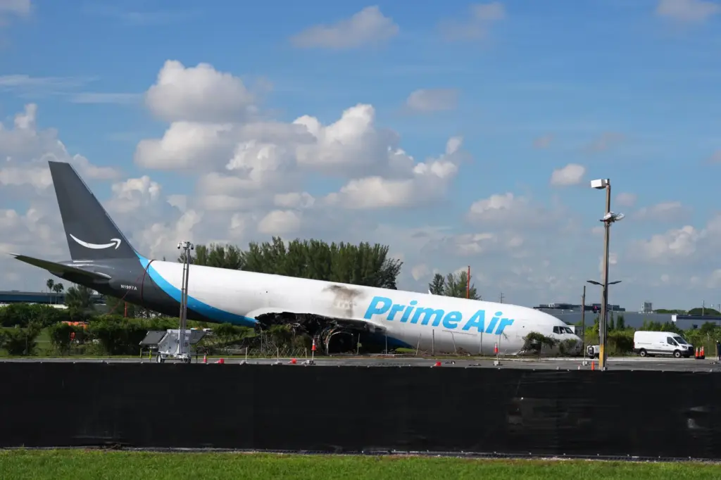 An Amazon cargo plane sits near Miami International Airport two...