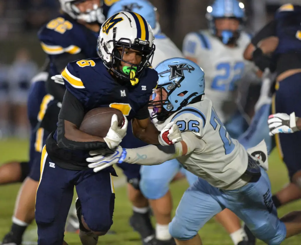 Mary Star back Myles Miller heads for endzone against North...