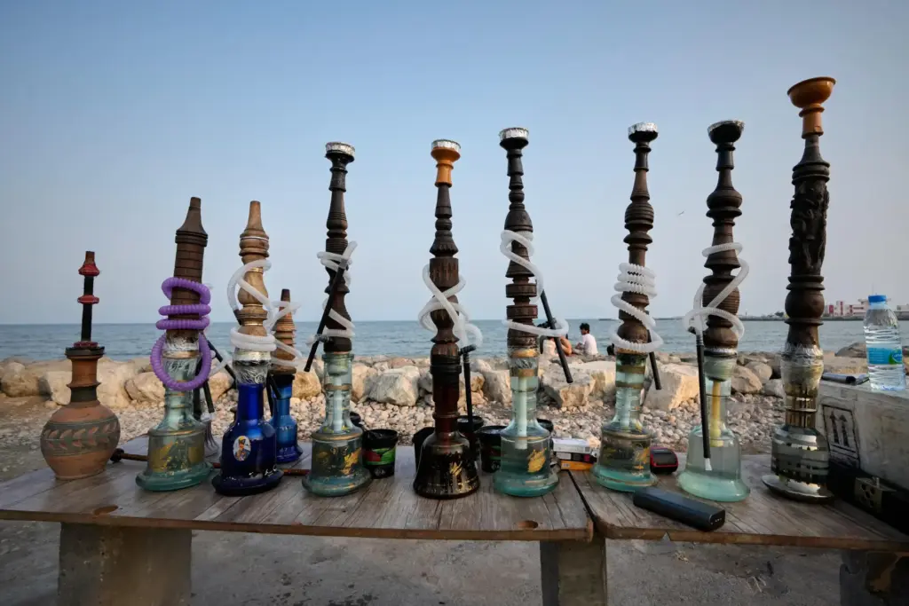 Water pipes are displayed along the corniche overlooking the Strait...