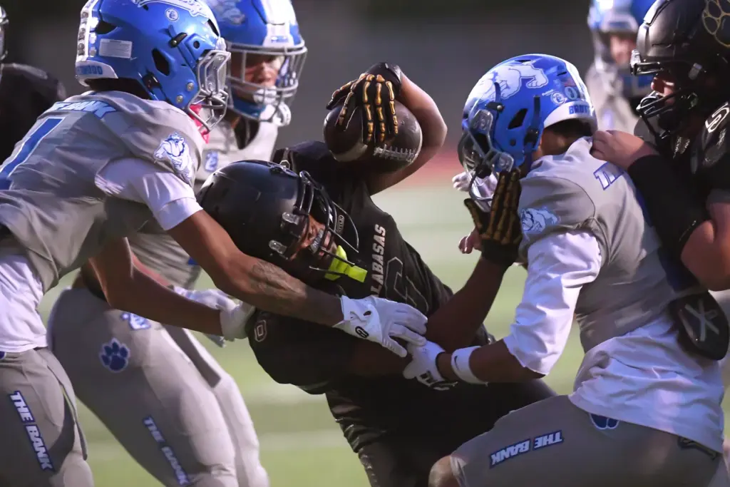 Calabasasâ Jesse Belvin tries to reach the end zone against...