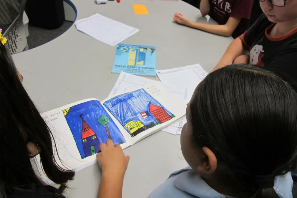 Orangethorpe Elementary School fifth-grader Mia Valencia reads to her classmates...