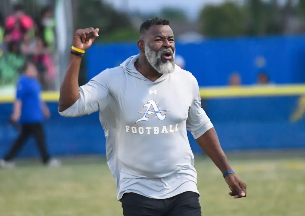 Bishop Amat her coach Kory Minor cheers on his team...