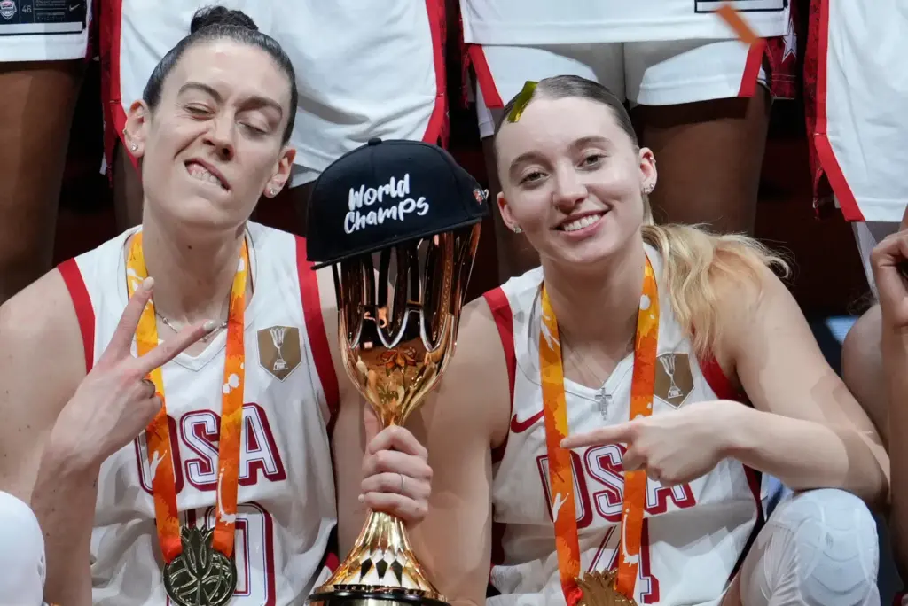 Team USA’s Breanna Stewart, left, and Paige Bueckers pose with...