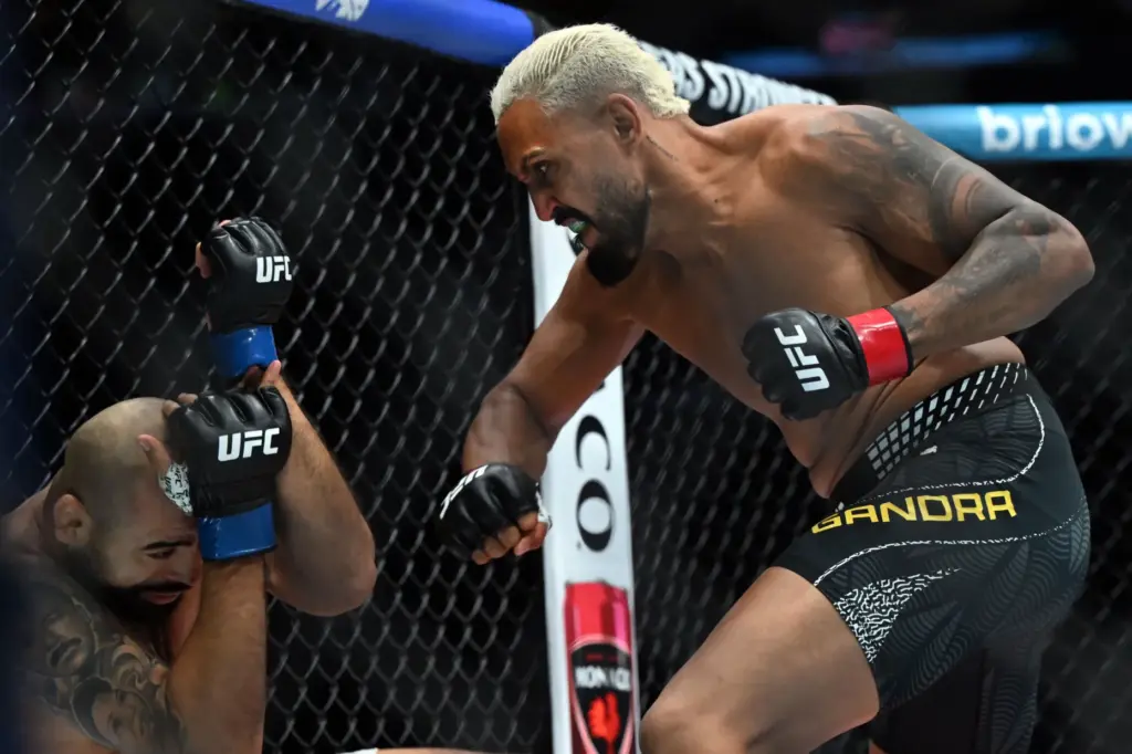 Ryan Gandra strikes Ozzy Diaz during their middleweight fight at...