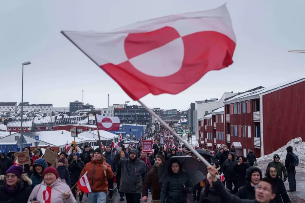 A crowd walks to the US consulate to protest against Trump's policy toward Greenland.
