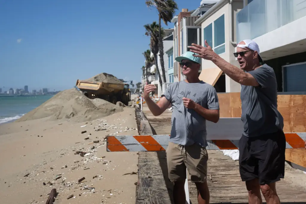 From left, A.D. Hale and Brent Donaldson watch as large...