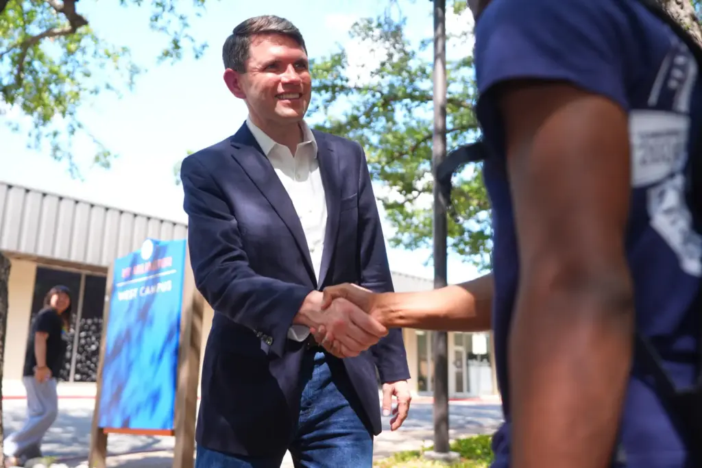 Democratic Senate candidate James Talarico, left, shakes hands after a...