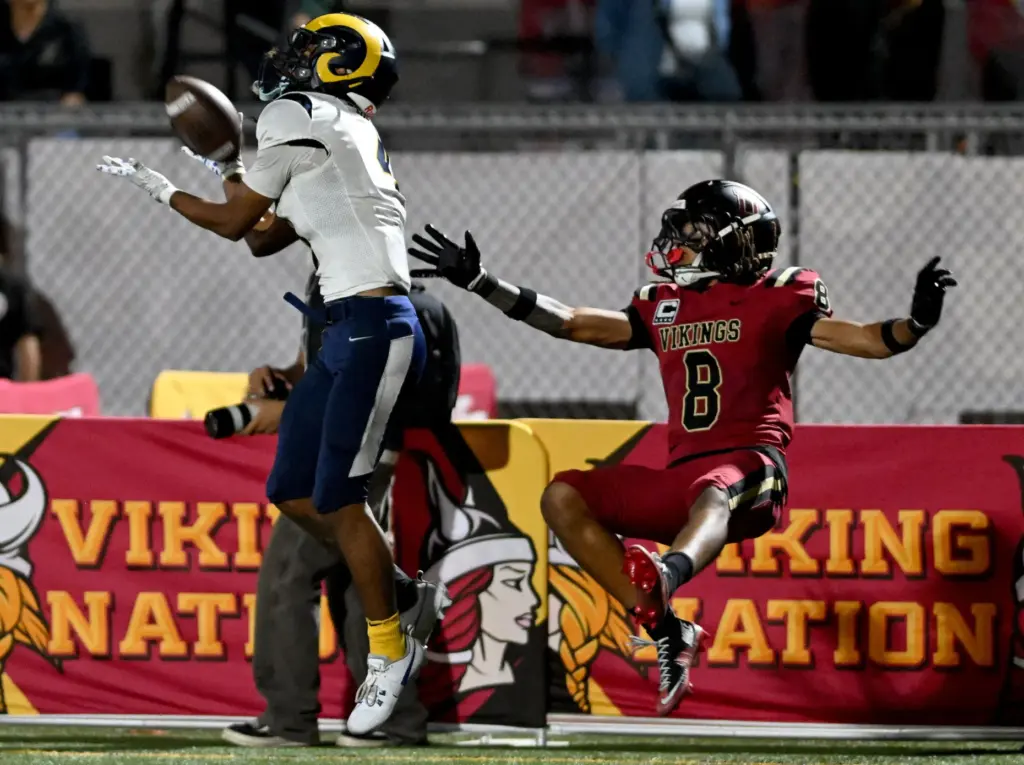 Millikan’s Aden Taufa (4) makes a catch just out of...