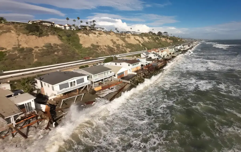 Homes, many of them red tagged, along Beach Road in...
