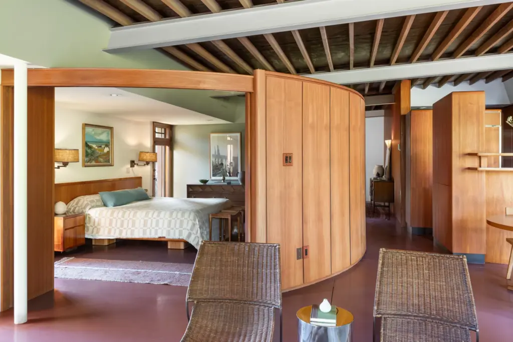 The curved bedroom wall slides open to the living room....