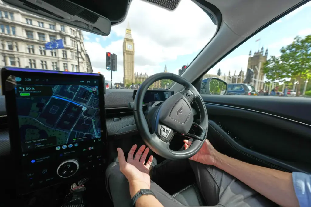 An Uber driver has his hands ready for intervention as...