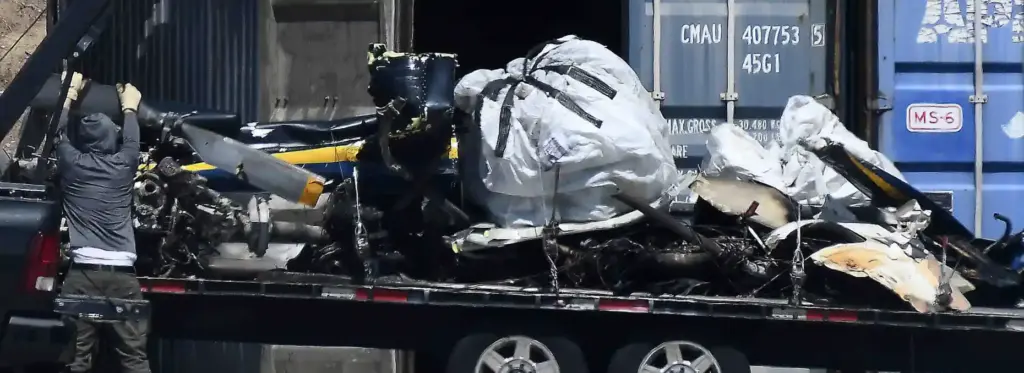 Salvage crews help NTSB investigators remove of whatâs left of...