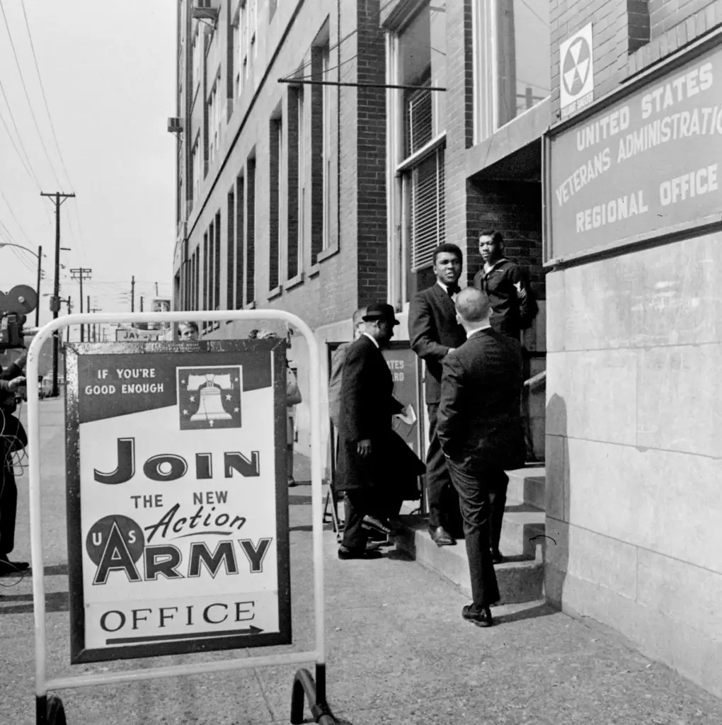 FILE – Heavyweight boxing champ Muhammad Ali greets a friend...