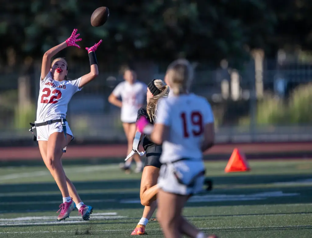 Orange Lutheran wide receiver Summer Mele (22) makes a catch...