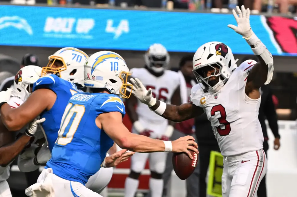 Arizona Cardinals safety Budda Baker (3) pressures Chargers quarterback Justin...