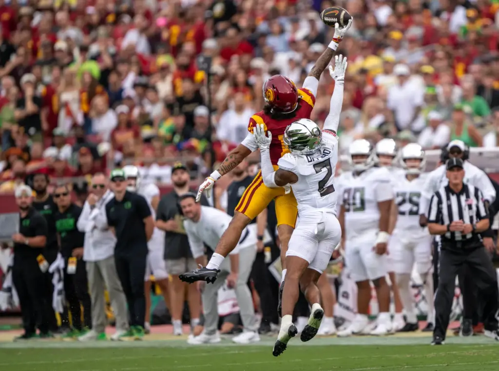 USC wide receiver Tanook Hines (16) gets his fingertips on...