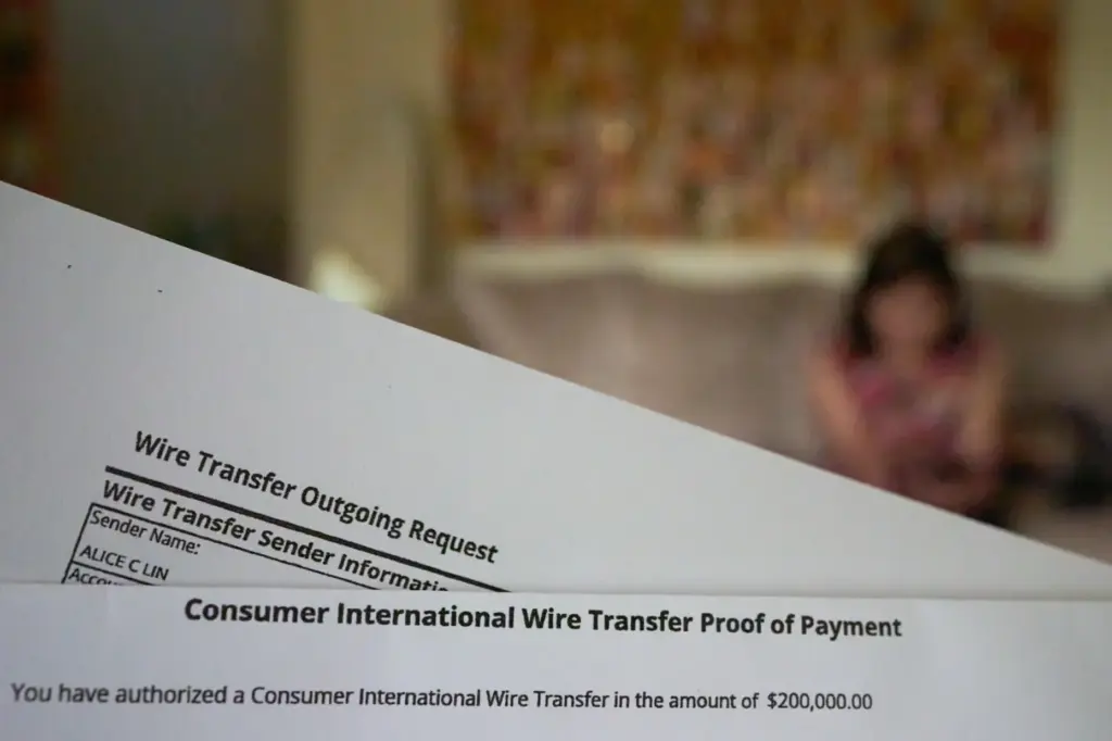 A copy of a wire transfer is seen as Alice...