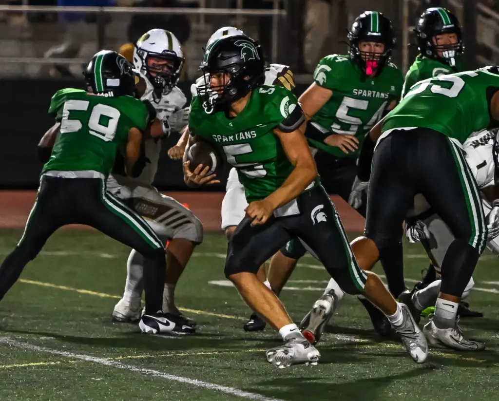 South Torrance quarterback Jake Egan runs with the ball during...