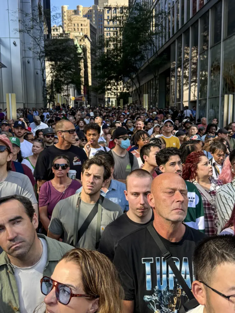 People wait in line to enter the 9/11 Memorial Pools...