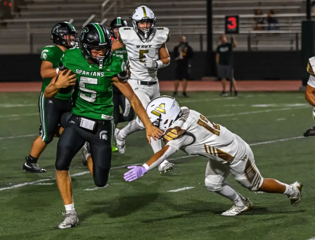 South Torrance quarterback Jake Egan runs with the ball during...