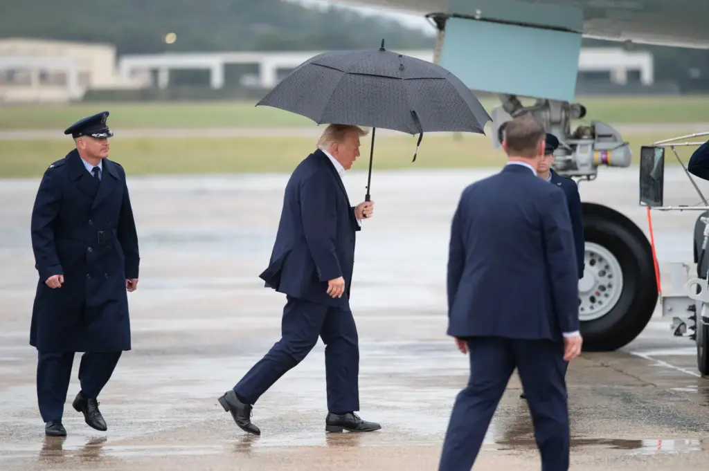 President Donald Trump walks to board Air Force One at...