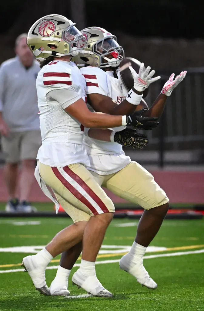 JSerraâs Dylan Brown (5), left, and R.J. Corley (25) of...