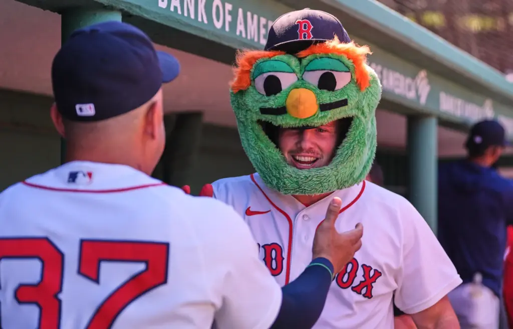 Boston Red Sox’s Adley Rutschman, right, is congratulated after his...