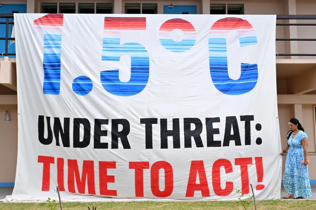 A climate change banner is unfurled by Greenpeace during the Pacific Islands Forum Leaders Meeting.