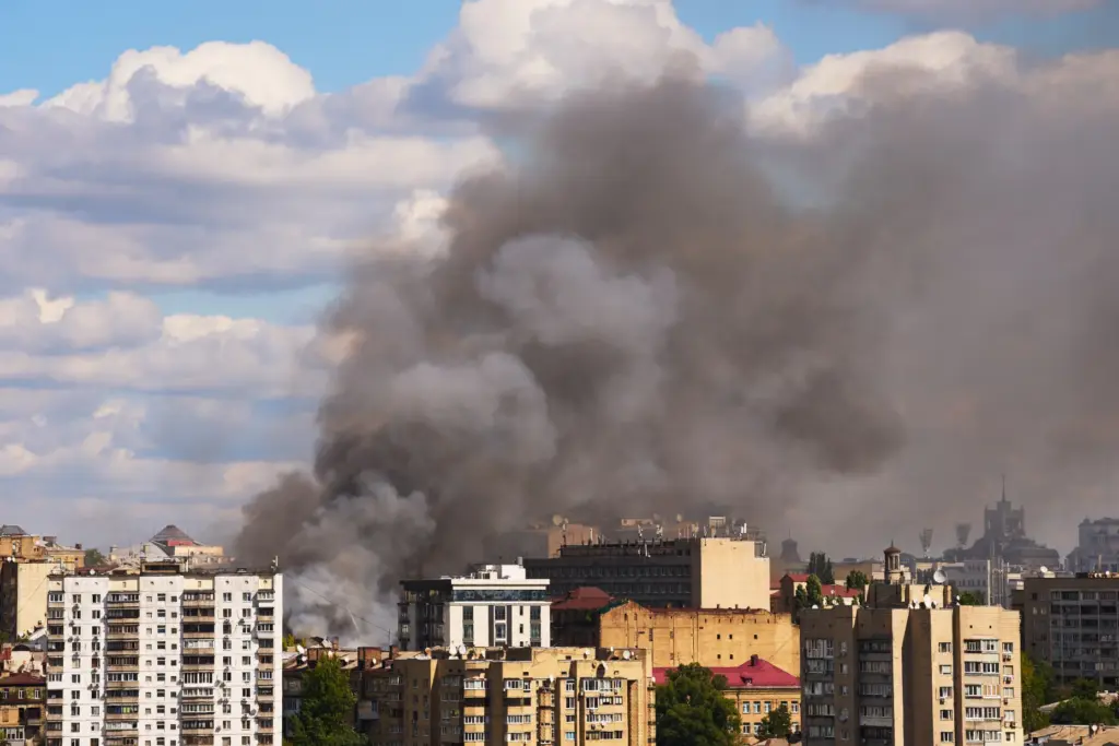 Smoke raises after a Russian drone attack in downtown Kyiv,...