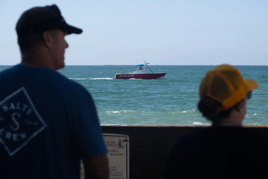 Harbor Patrol Lifeguards monitor the waters along the Long Beach...