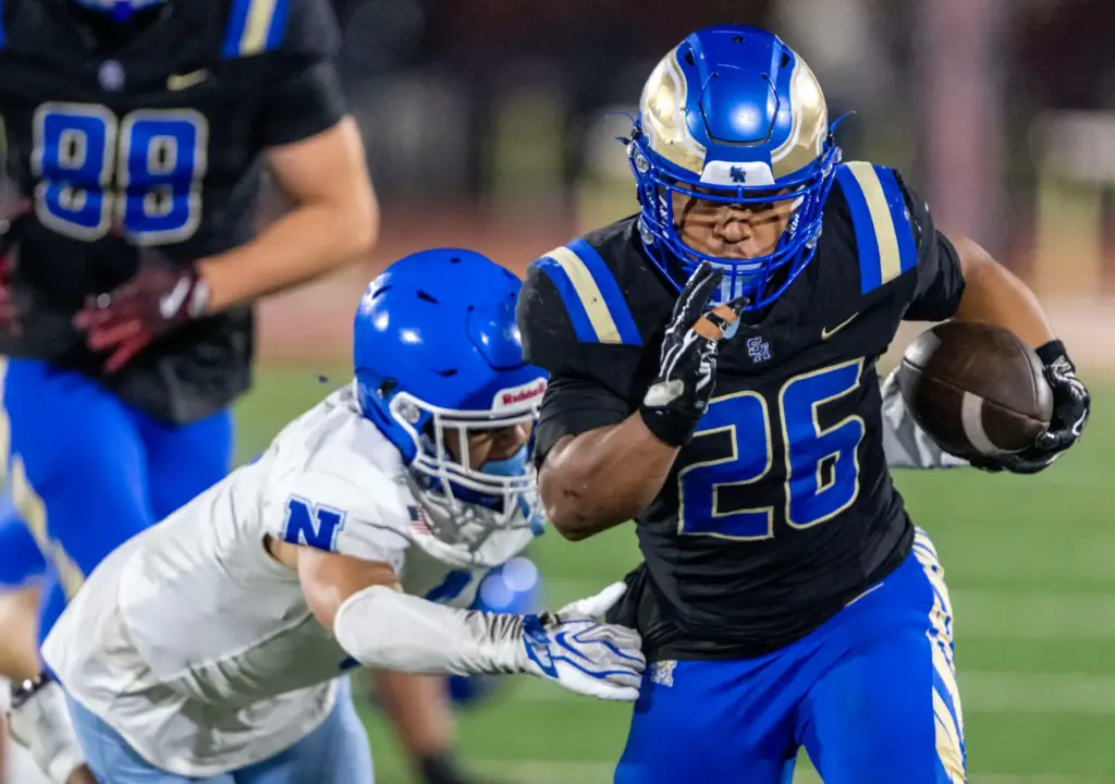Santa Margarita running back Adrian Petero (26) carries the ball...