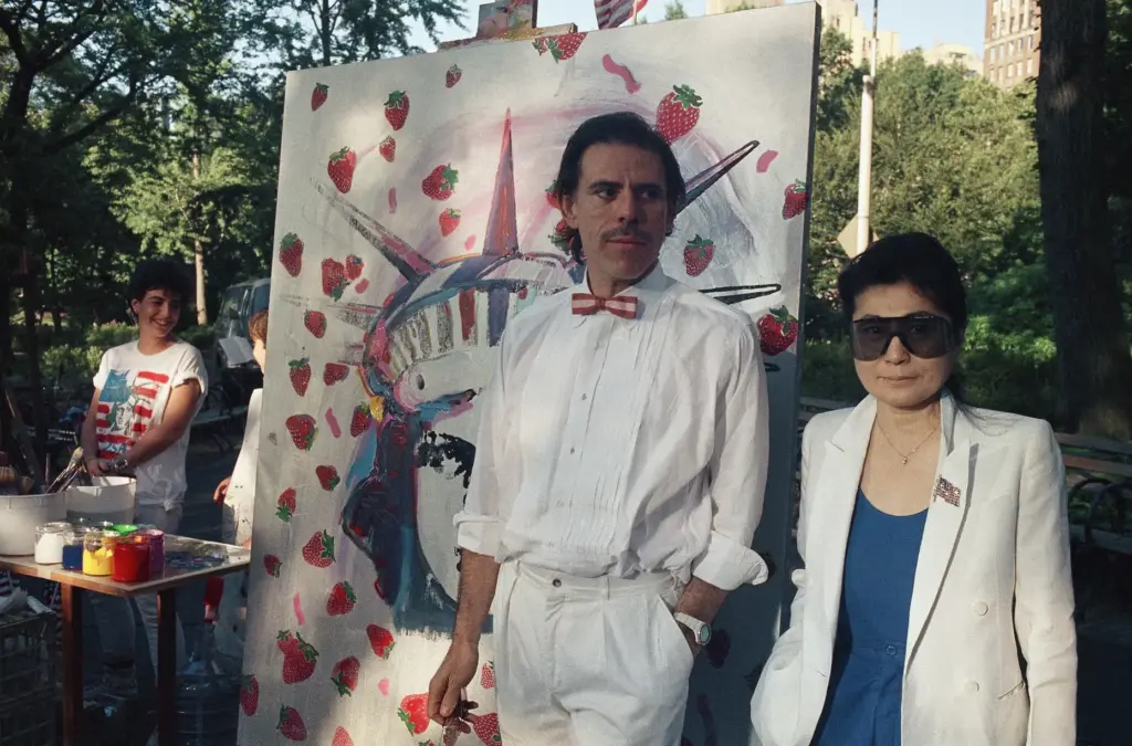 FILE – Artist Peter Max, left, and Yoko Ono pose...