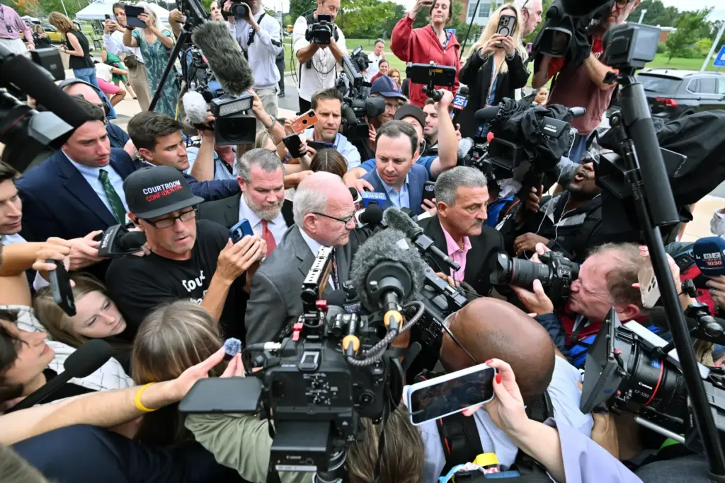 Kevin Reddington, lawyer for Lindsay Clancy is surrounded by reporters.