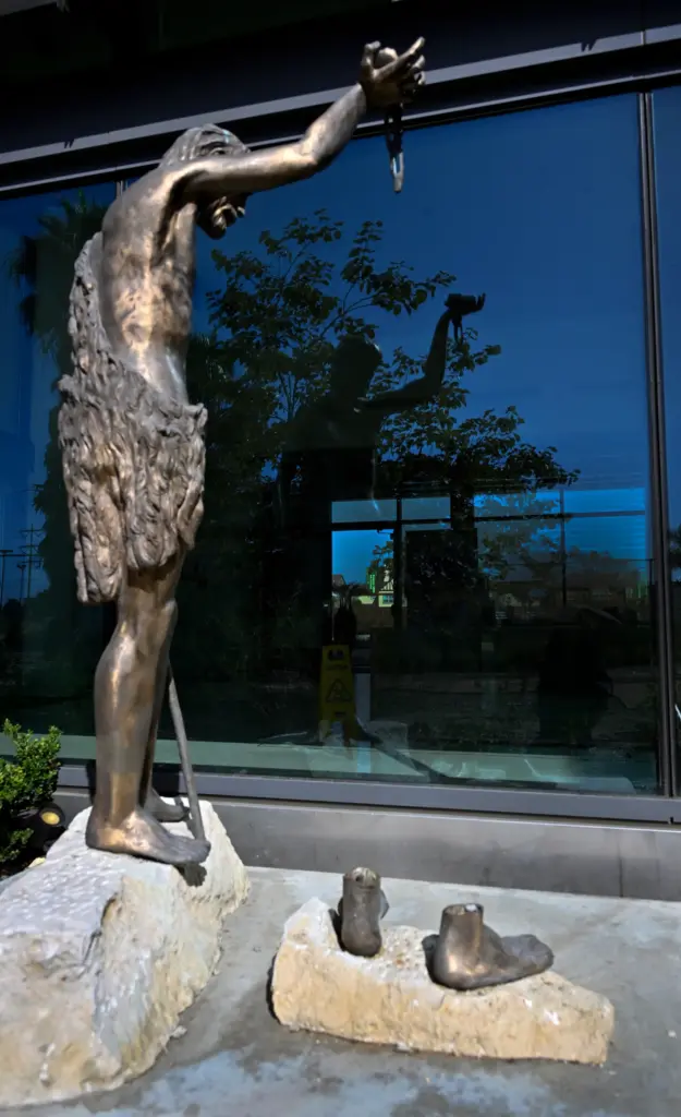 The remains of a bronze statue can be seen on...